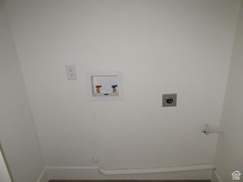 Clothes washing area with electric dryer hookup, washer hookup, and gas dryer hookup