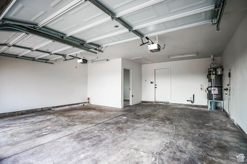 Garage with a garage door opener and water heater
