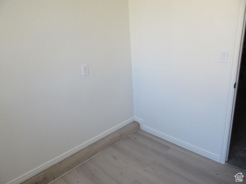 Empty room featuring light wood-type flooring
