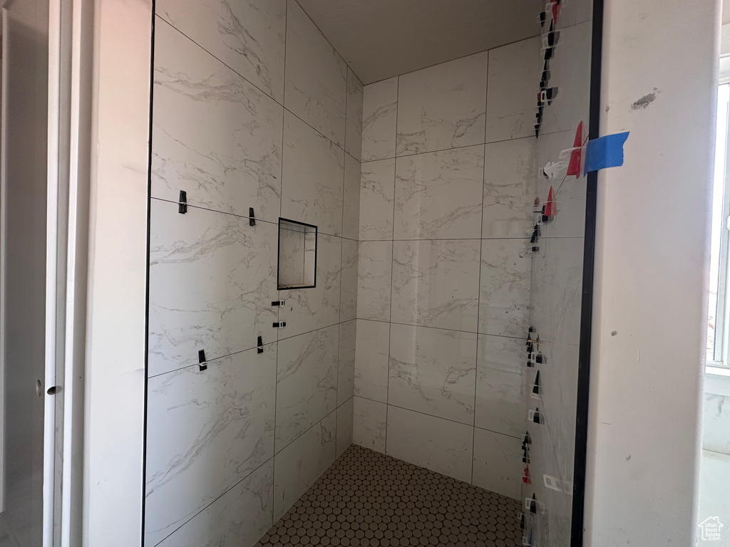 Full bathroom with a shower stall