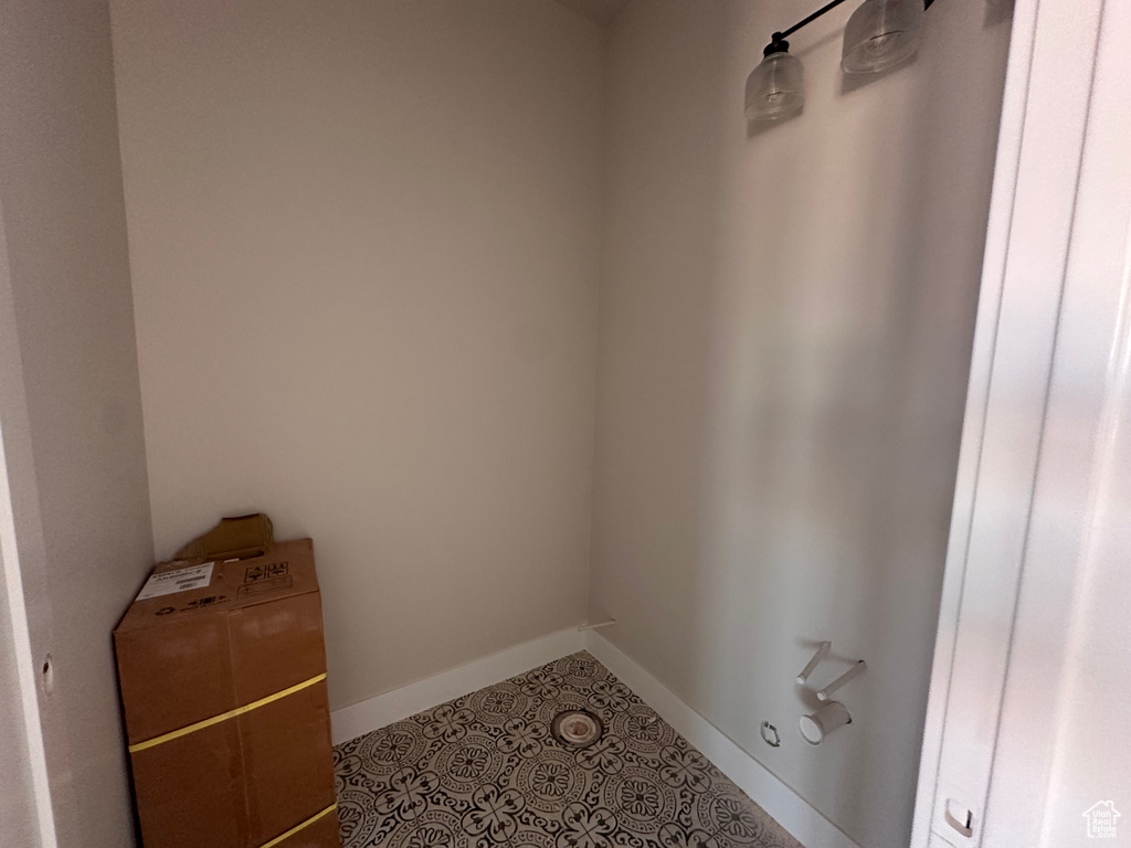 Laundry room featuring baseboards