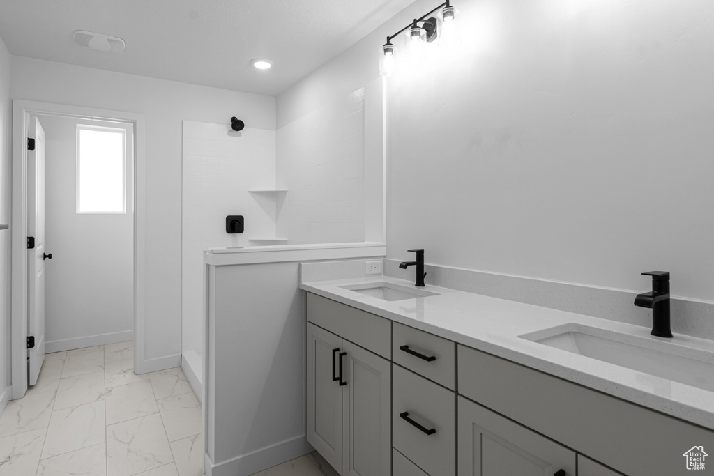 Bathroom with vanity and walk in shower
