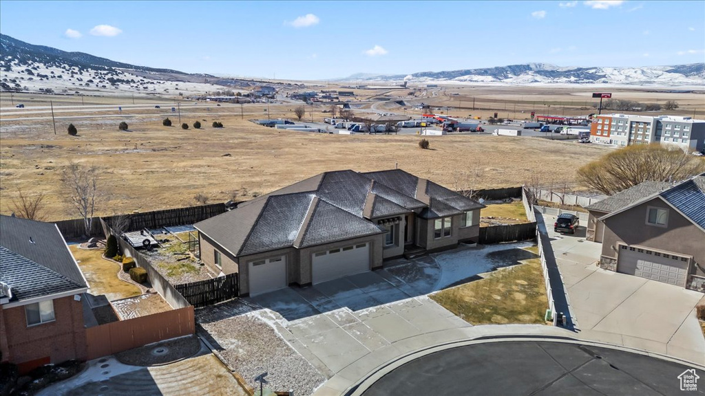 Birds eye view of property with a mountain view