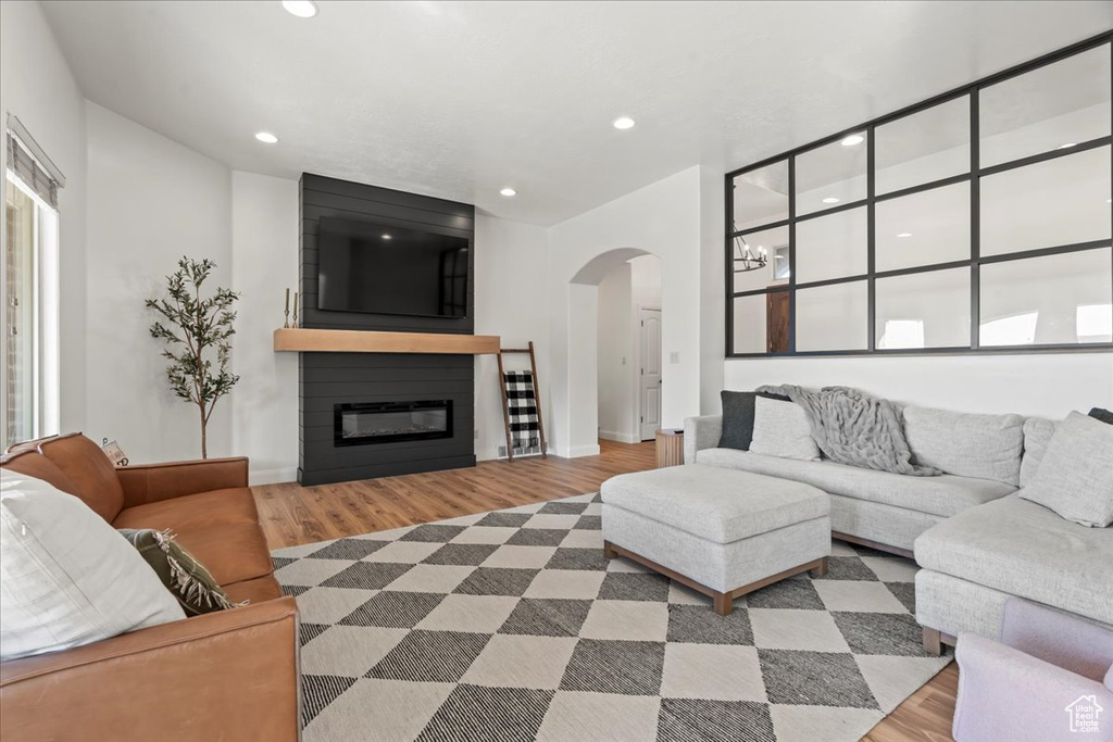 Living room featuring a fireplace and wood-type flooring