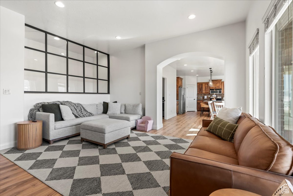 Living room with light hardwood / wood-style floors