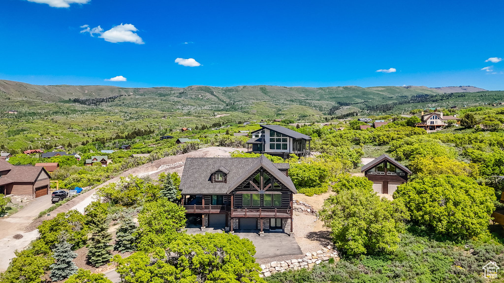 View of subject property featuring a mountainous background
