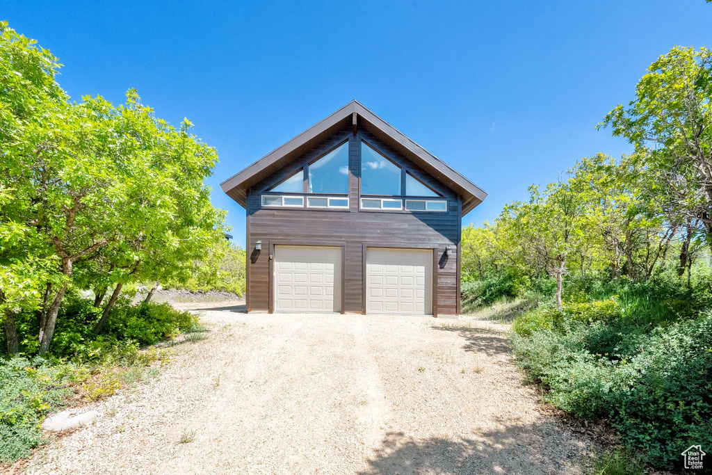 Garage featuring driveway