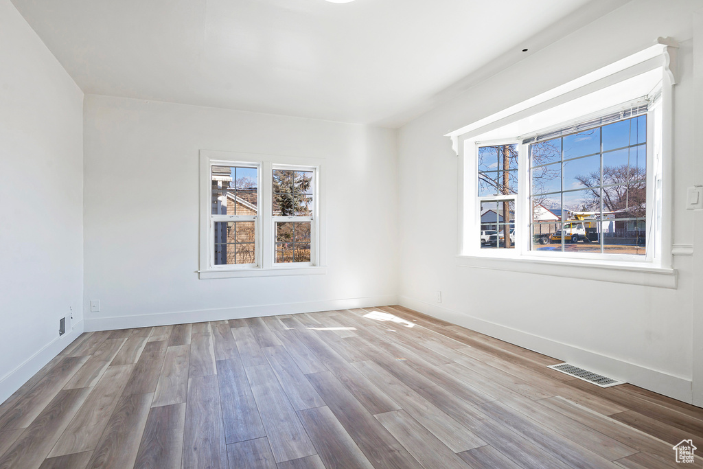 Spare room featuring light wood-type flooring