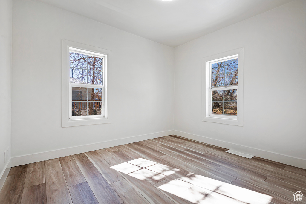 Spare room featuring light hardwood / wood-style floors