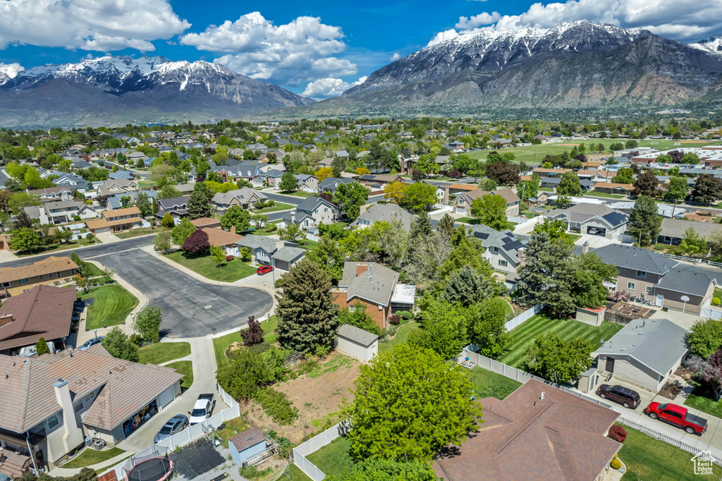 Aerial view of residential area featuring mountains