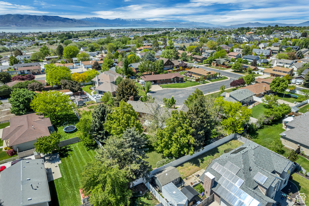 Aerial perspective of suburban area featuring a mountain backdrop