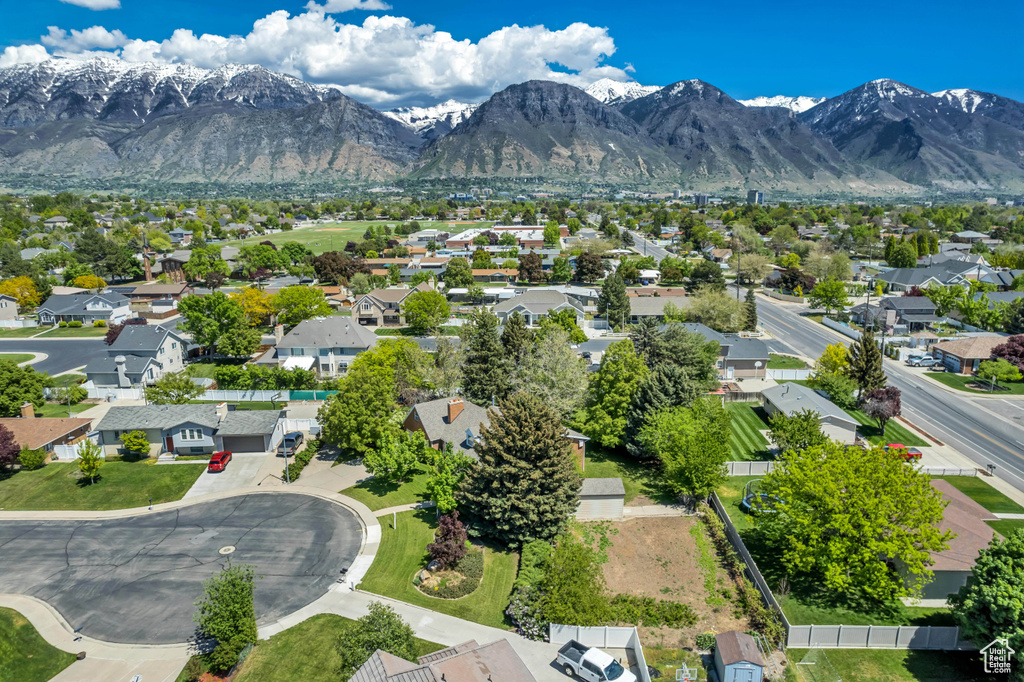 Aerial perspective of suburban area with a mountainous background