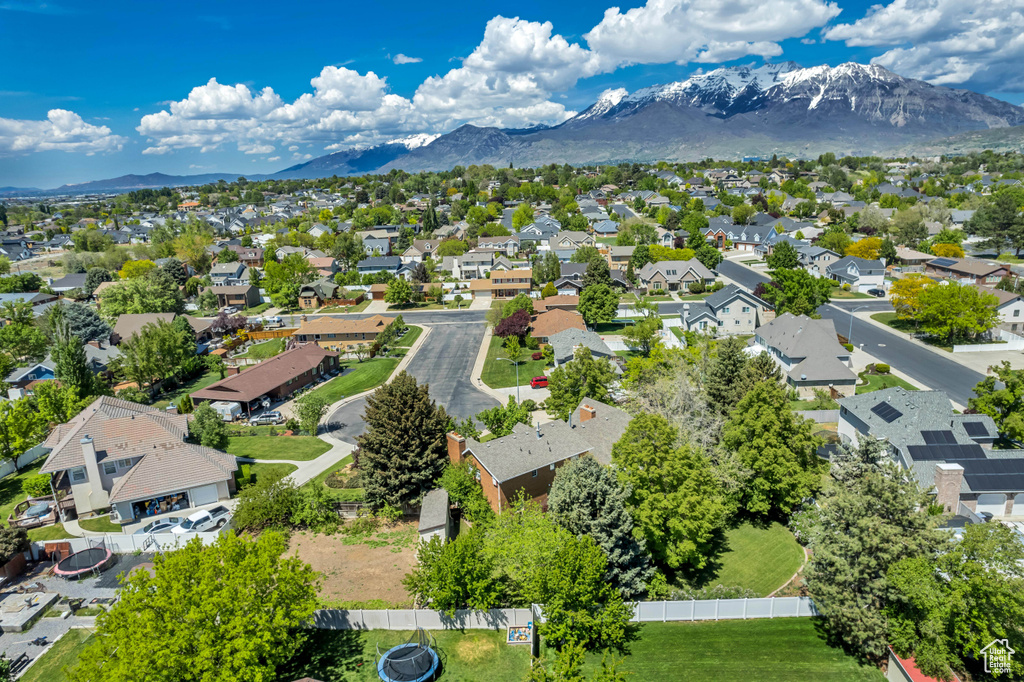 Aerial perspective of suburban area with a mountainous background