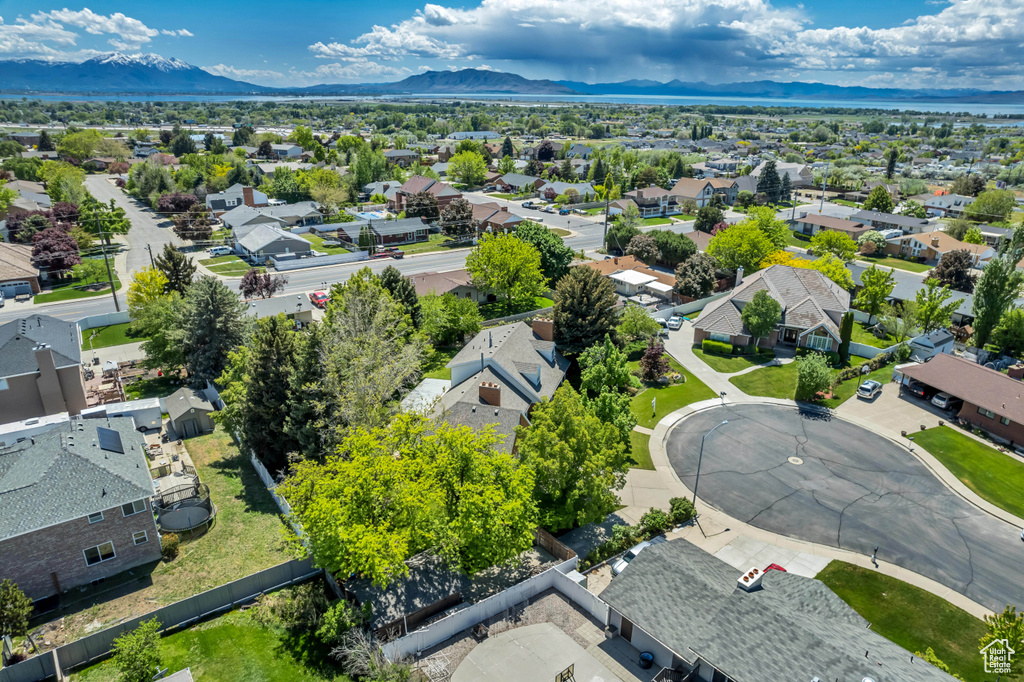 Aerial view of residential area featuring a mountainous background