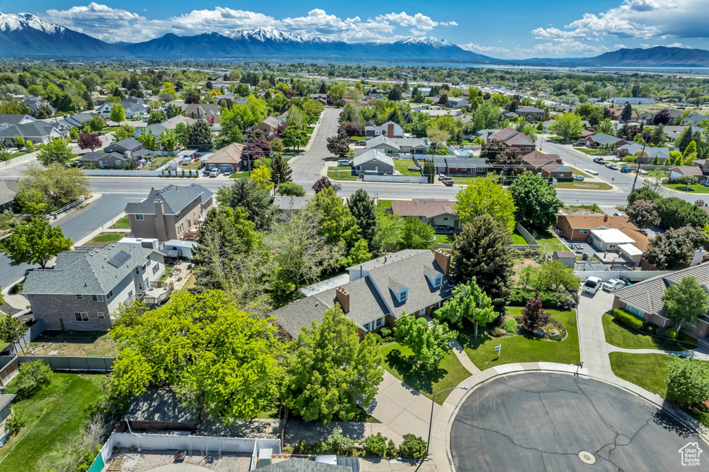 Aerial view of residential area featuring a mountain backdrop