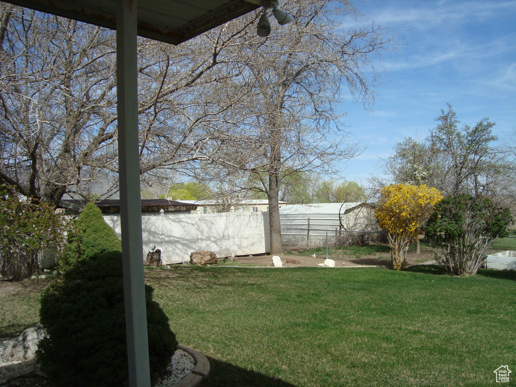 View of yard featuring fence