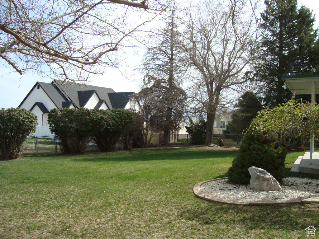 View of yard featuring fence