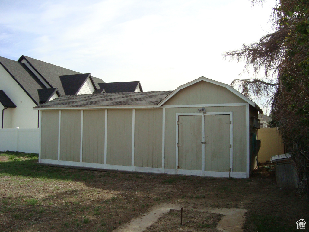 View of shed with fence