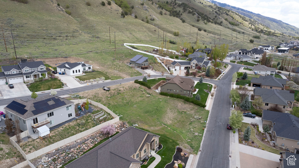 Birds eye view of property with a residential view and a mountain view