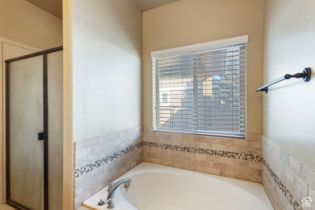 Bathroom with plus walk in shower