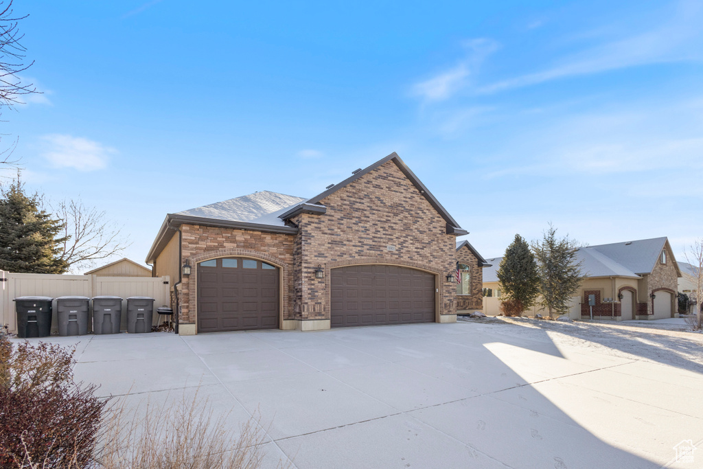 View of property exterior with a garage