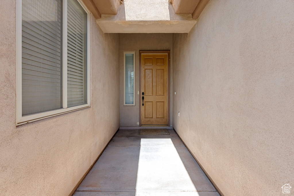 Entrance to property with stucco siding