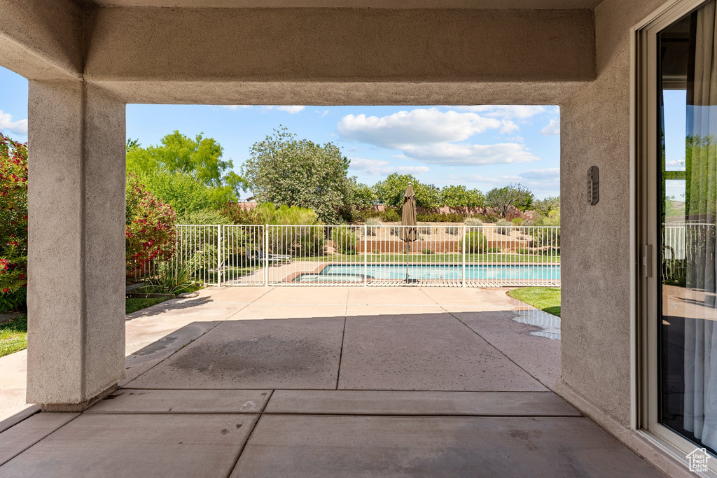 Fenced backyard with a patio area