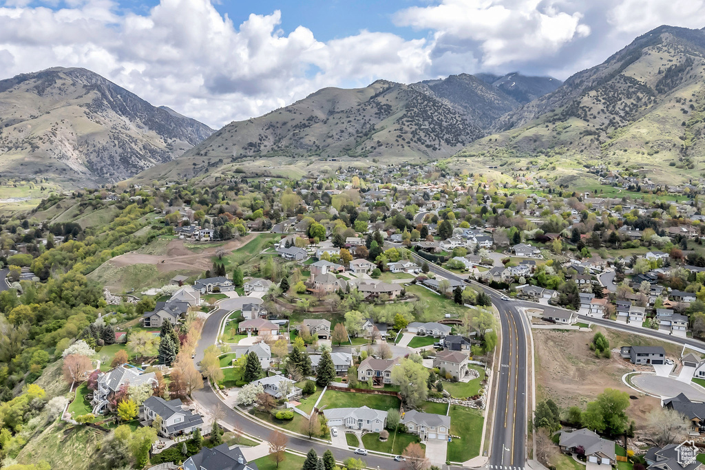 Birds eye view of property with a residential view and a mountain view