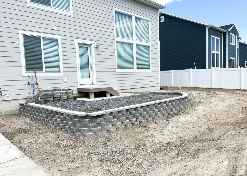 Back of house with fence