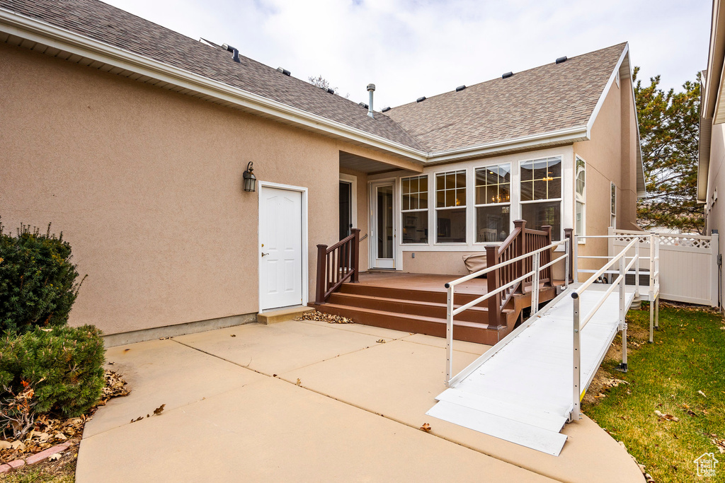 Rear view of property featuring a patio
