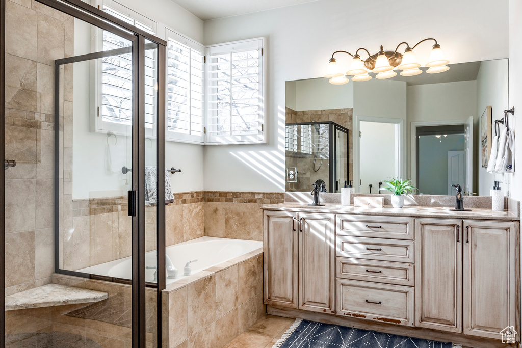 Bathroom with vanity, plus walk in shower, and a wealth of natural light