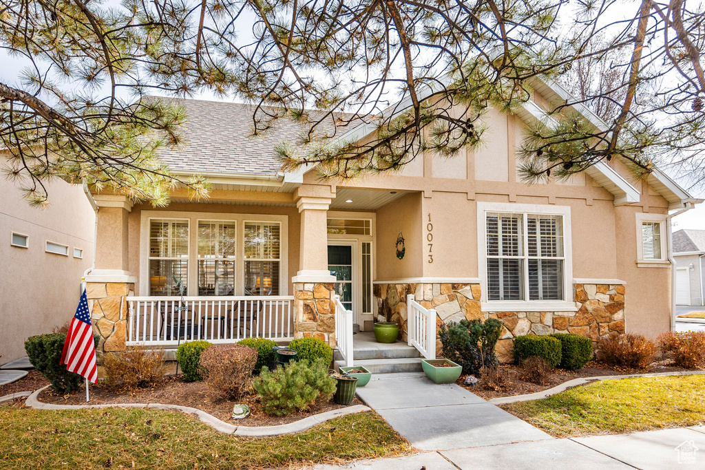 View of front of home featuring covered porch