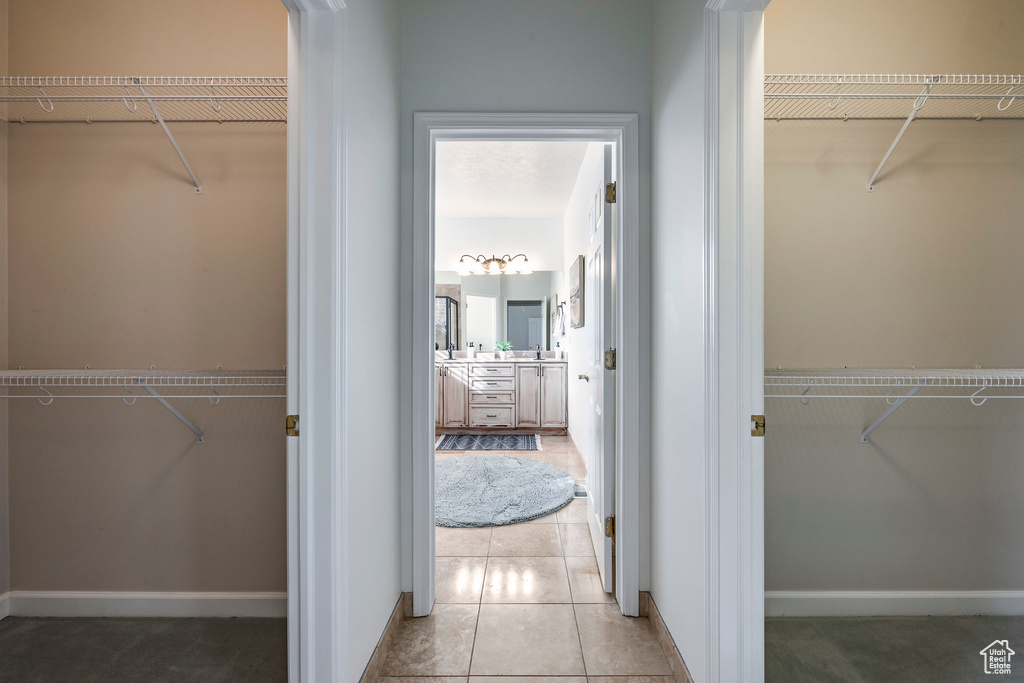 Walk in closet featuring tile patterned flooring