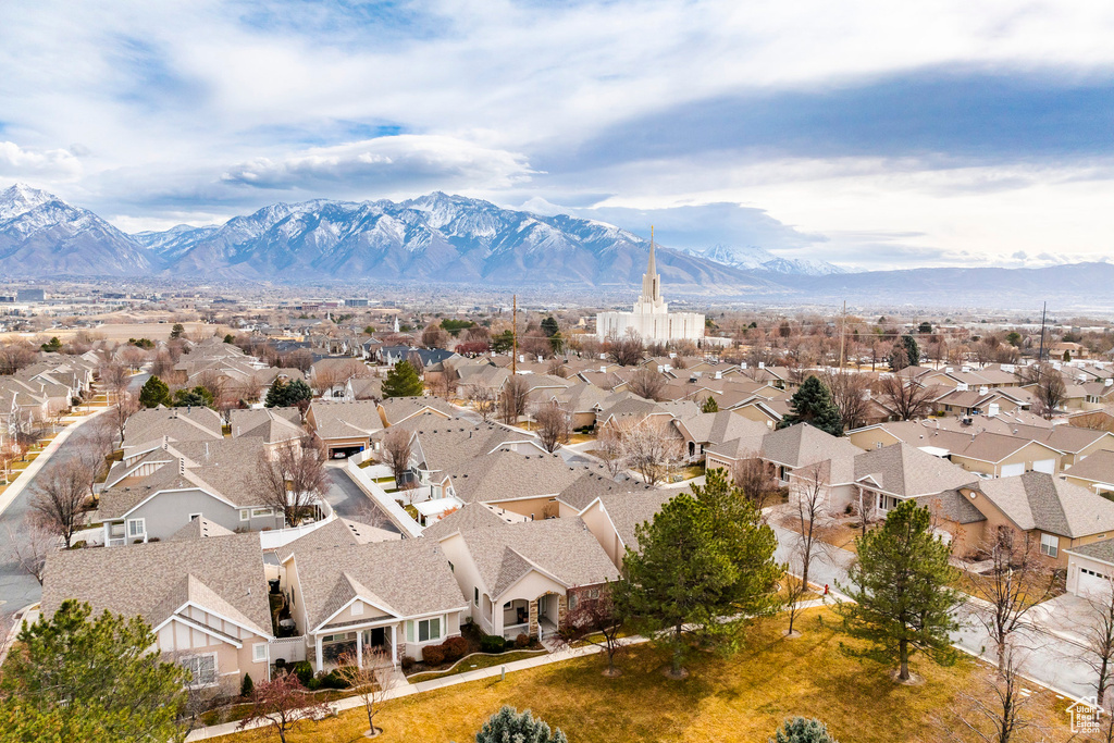 Aerial perspective of suburban area featuring a mountain backdrop