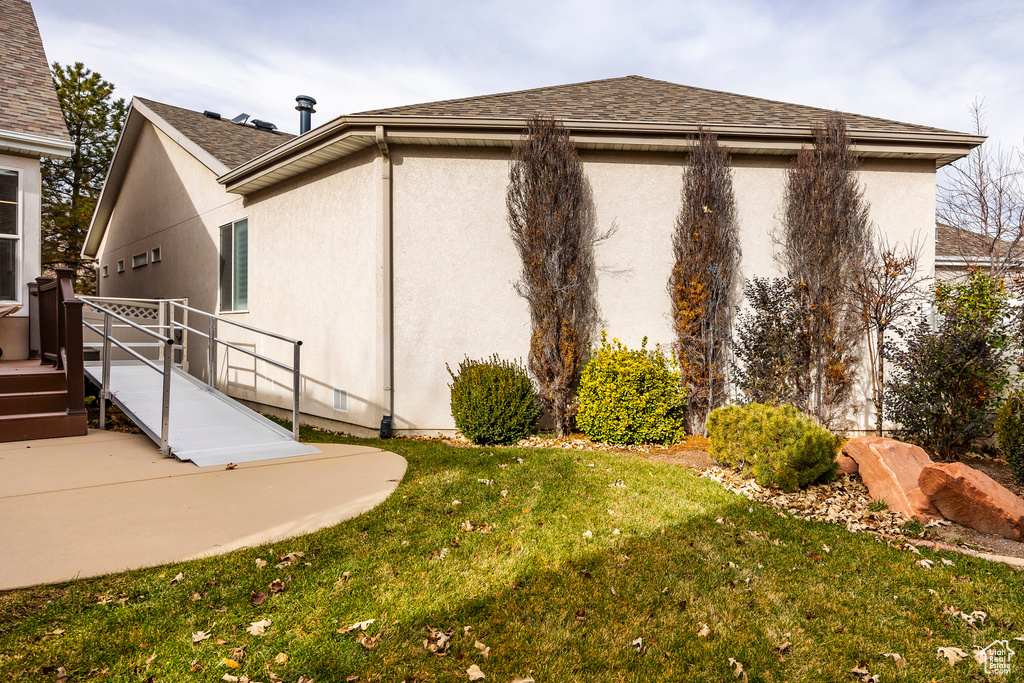 Exterior space featuring a yard
