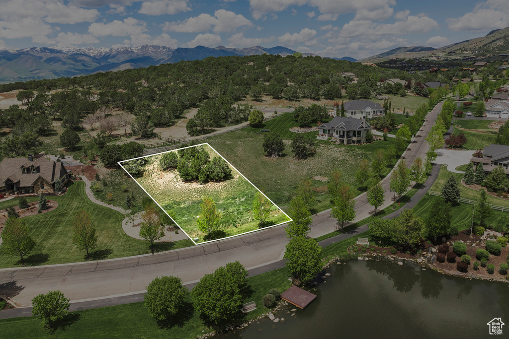 View of property location featuring property boundaries highlighted and a water and mountain view