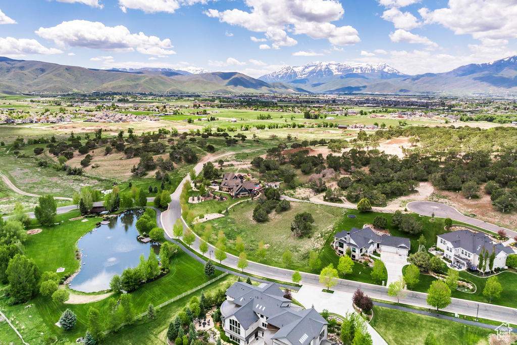 Aerial view of residential area featuring a water and mountain view