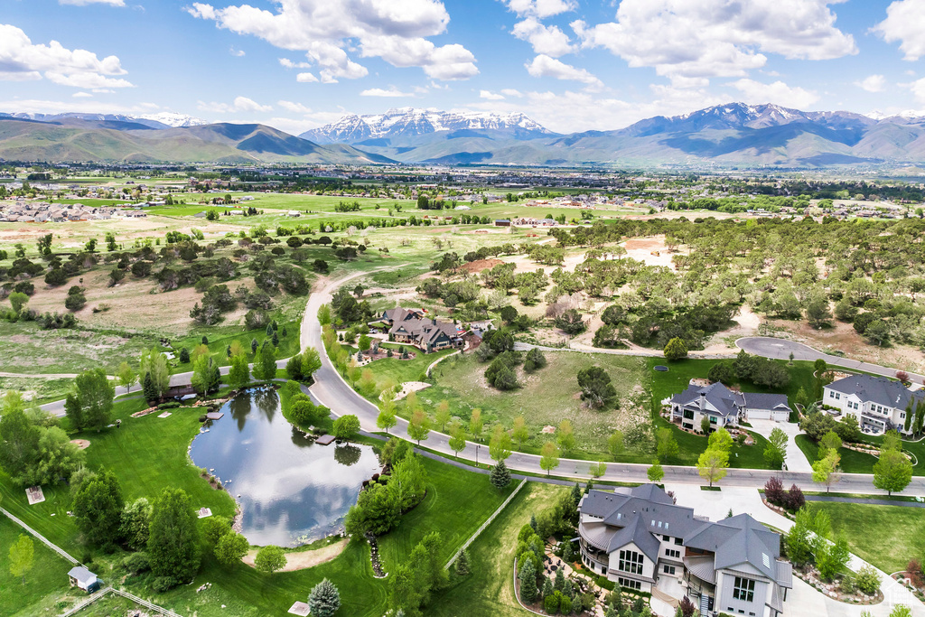 Aerial perspective of suburban area featuring a water and mountain view