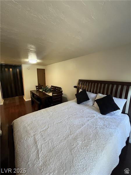 Bedroom featuring wood finished floors