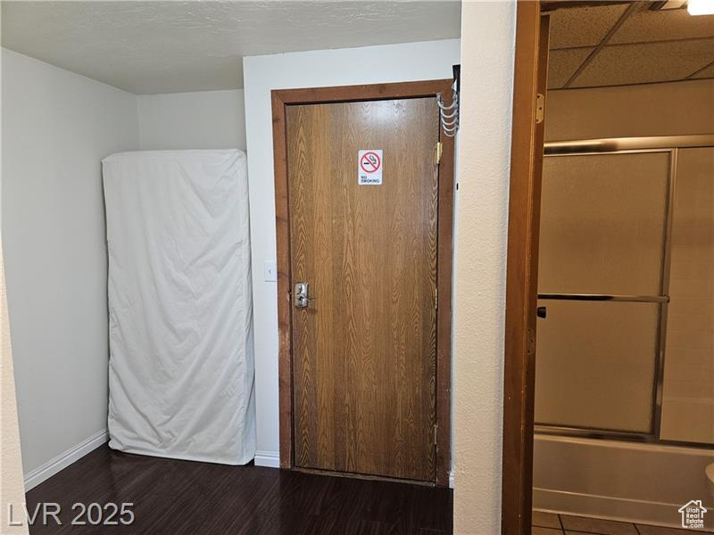 Interior space with wood finished floors and baseboards