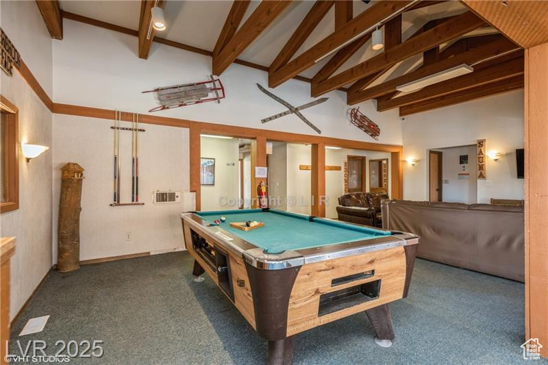 Recreation room with billiards table, high vaulted ceiling, beamed ceiling, and carpet flooring
