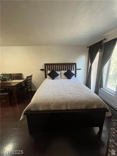 Bedroom with a textured ceiling