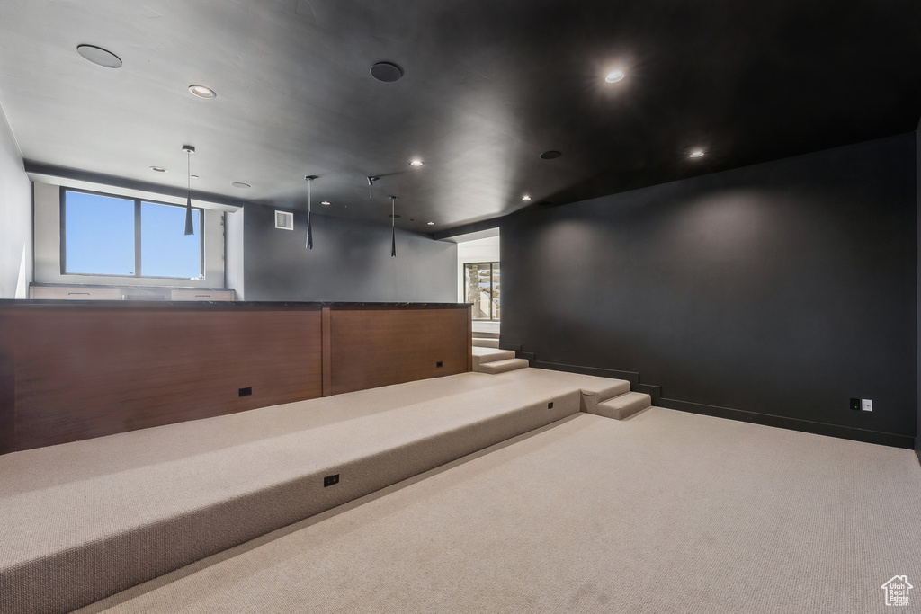Carpeted cinema with recessed lighting
