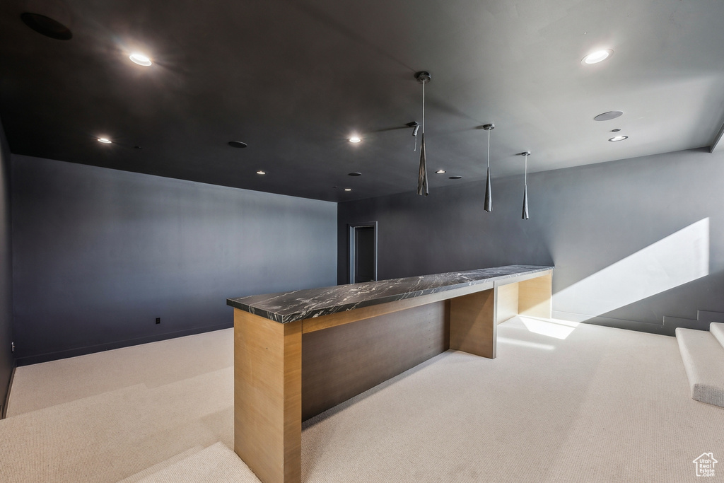 Bar area featuring carpet floors and recessed lighting