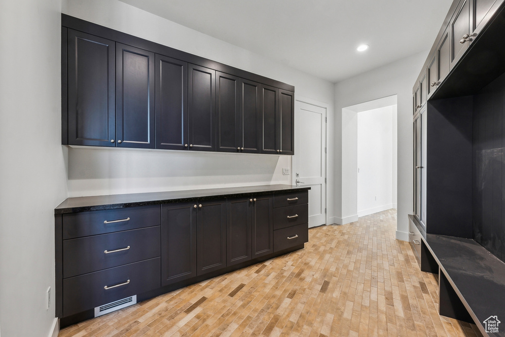 Mudroom featuring light wood-style flooring and recessed lighting