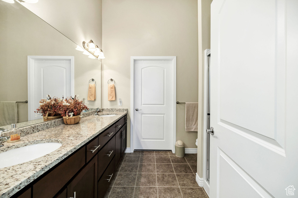 Bathroom with vanity and tile patterned floors