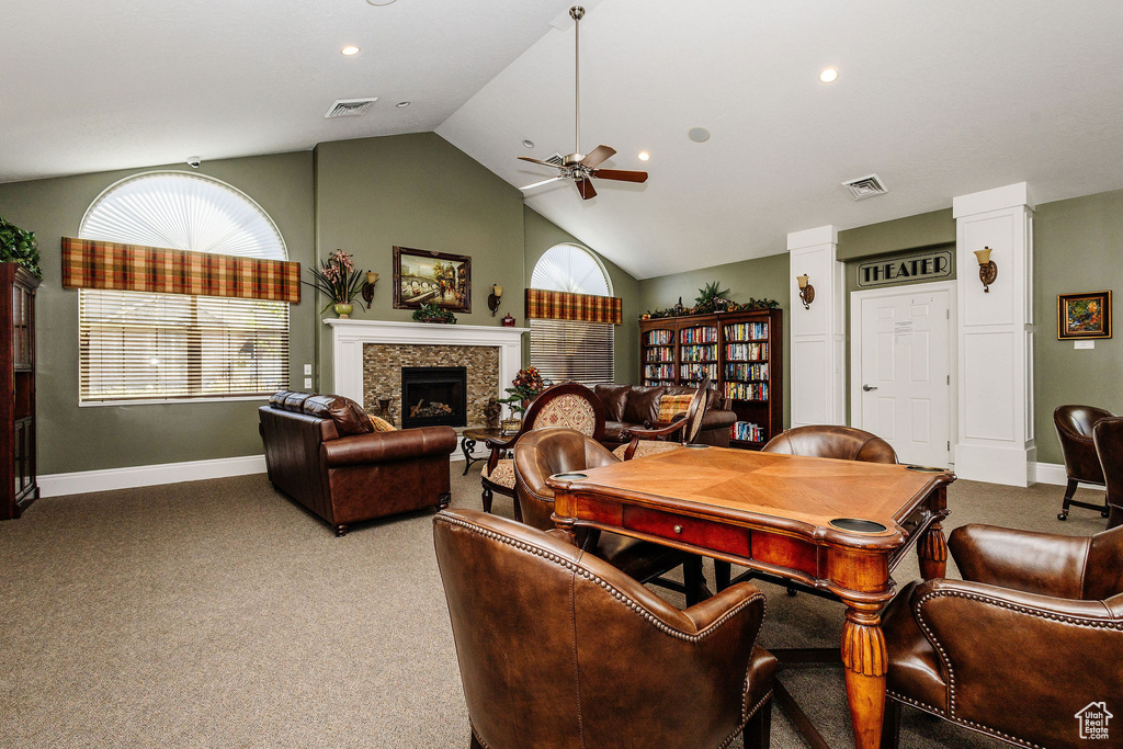 Living room with vaulted ceiling, carpet, and ceiling fan