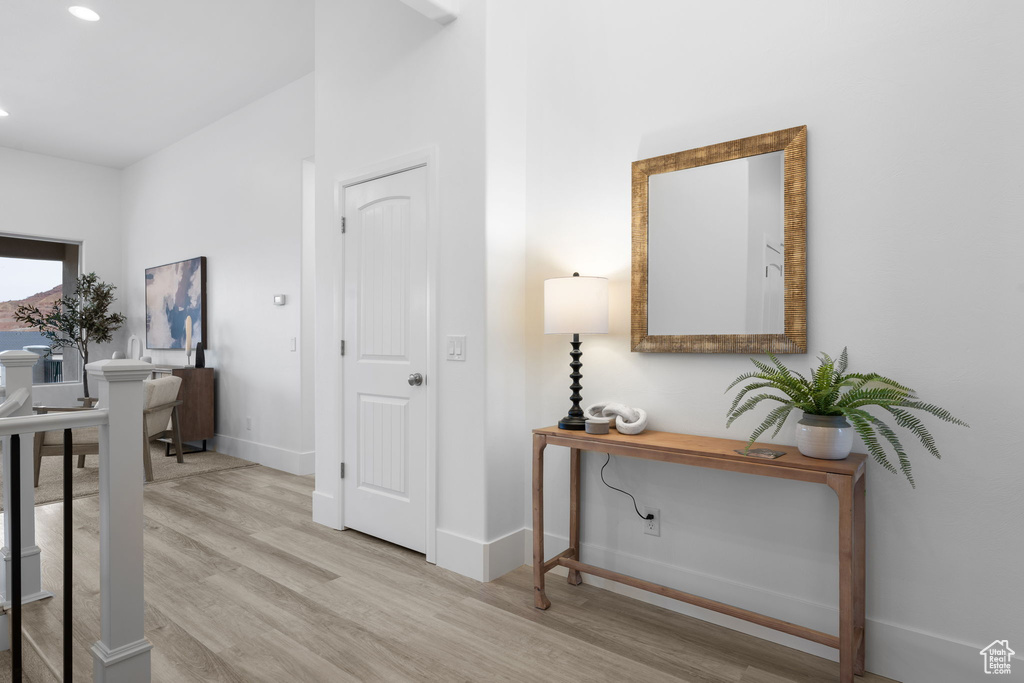 Hall featuring light wood-type flooring