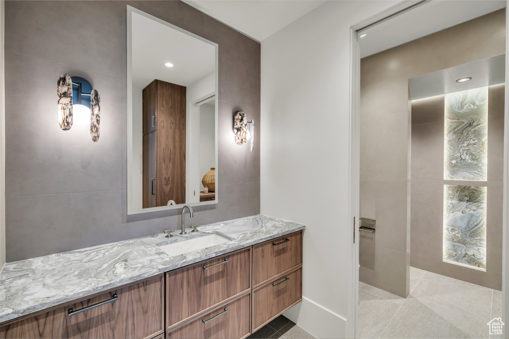 Bathroom with vanity, recessed lighting, and tile patterned floors