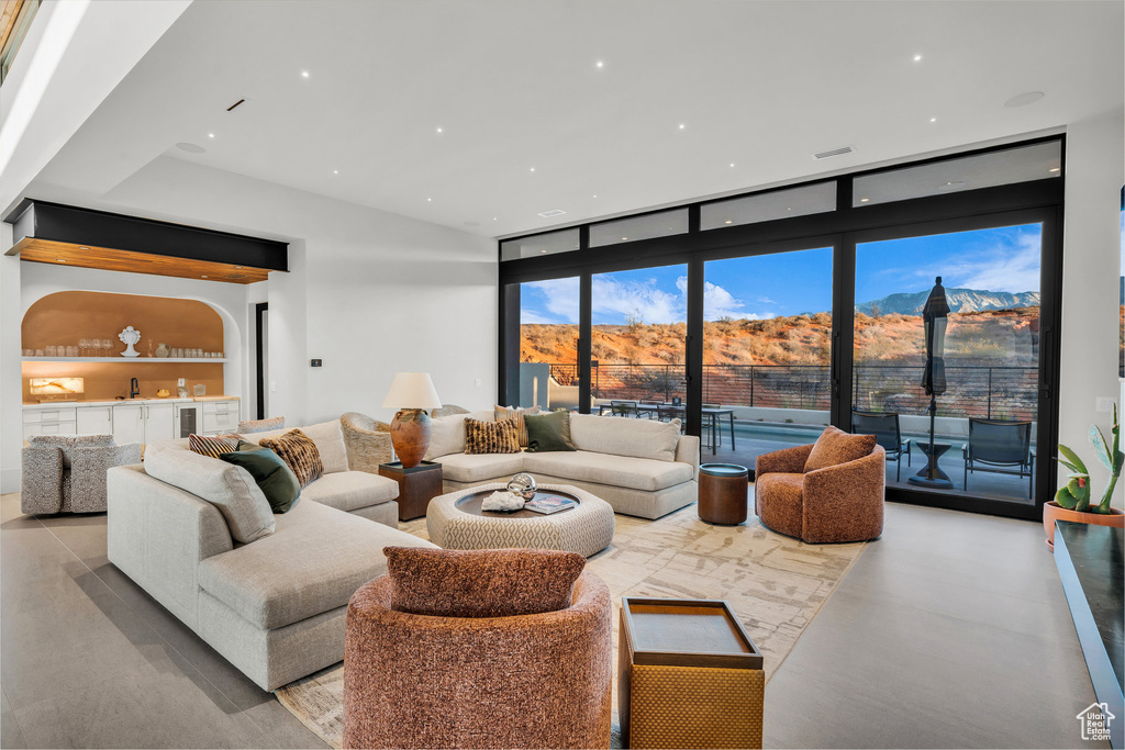 Living area featuring a mountain view and recessed lighting